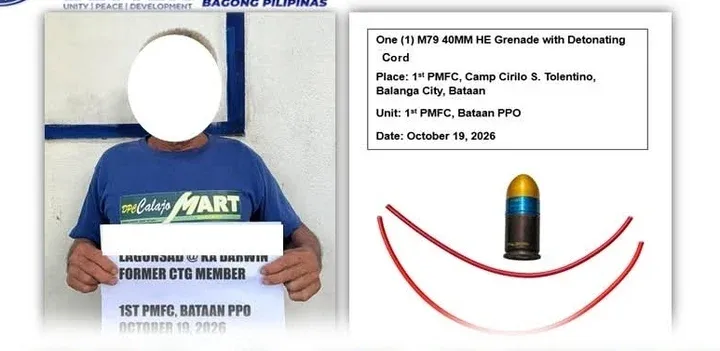 Former CTG member "Ka Darwin" surrenders and turns over one M79 40mm high-explosive grenade with detonating cord to the 1st Provincial Mobile Force Company at Camp Cirilo S. Tolentino, Balanga City, Bataan on October 19, 2026.